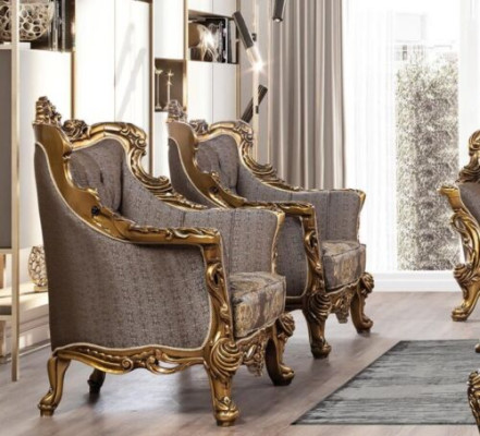 Een luxueuze klassieke fauteuil in donkergrijs met een gouden barokdesign van Chesterfield