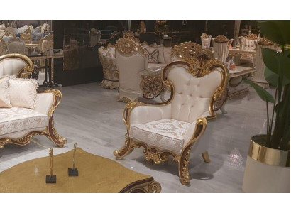 Luxe klassieke fauteuil met oor in wit-gouden barok design.